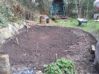 The string marker is temporarily moved to render the ground relatively level.